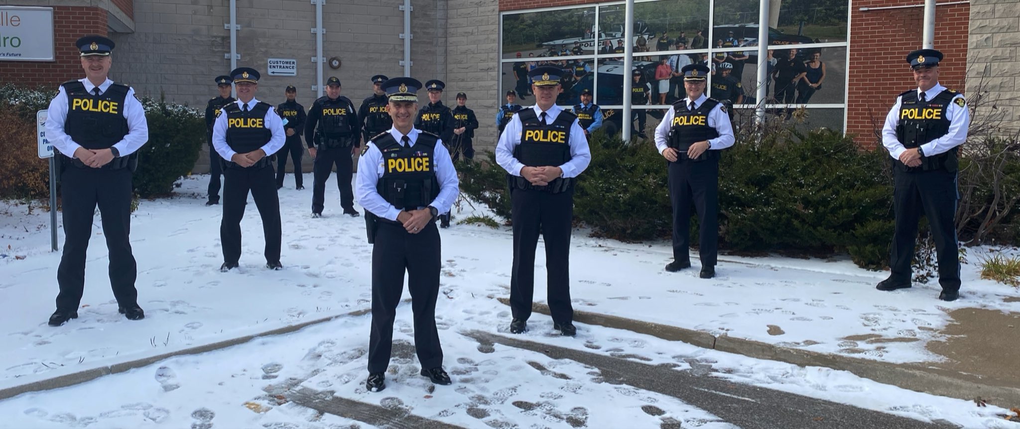 Officers in front of Orangeville OPP Detachment